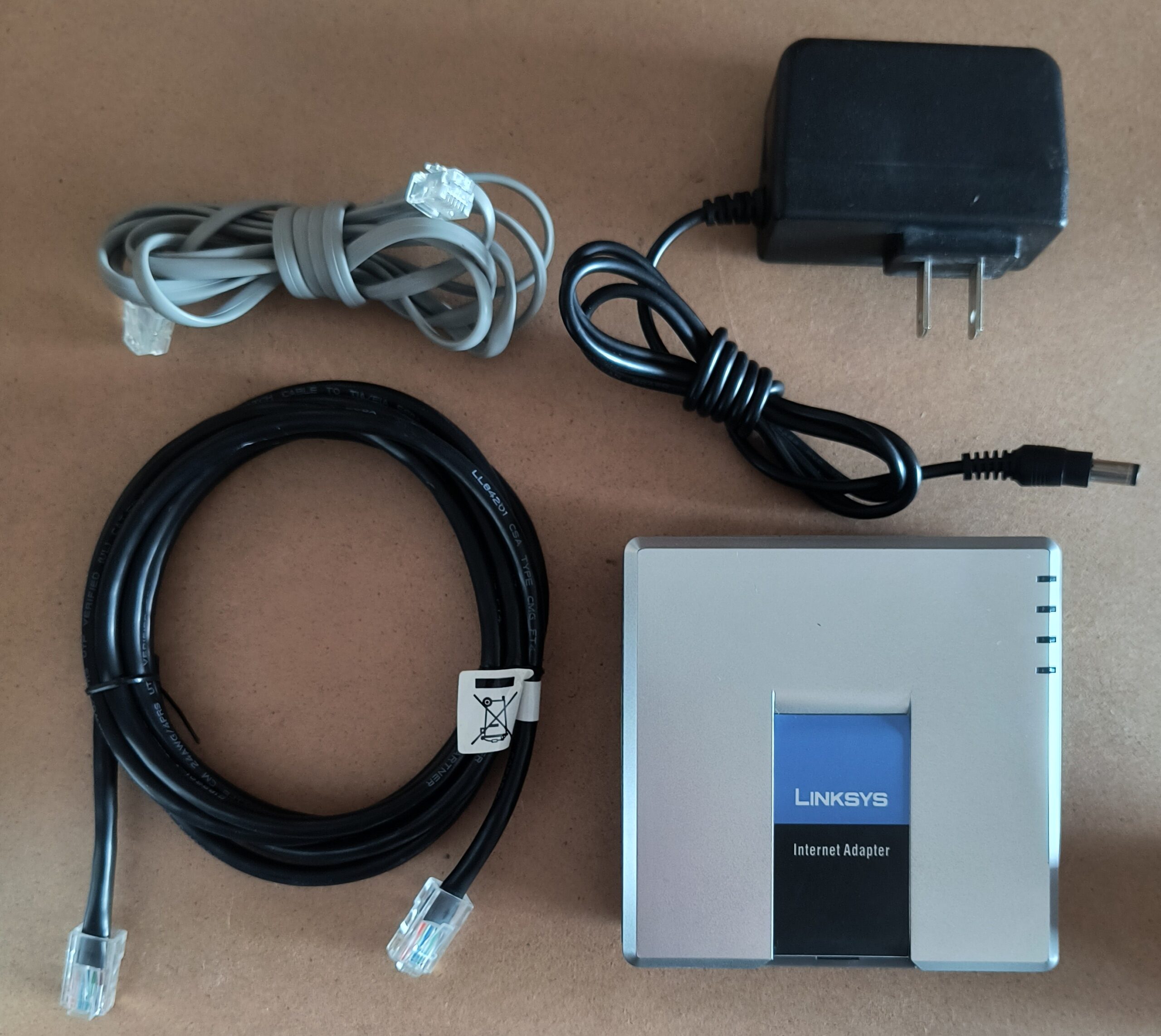 Linksys PAP2T Internet Phone Adapter with Power Supply and Cables
