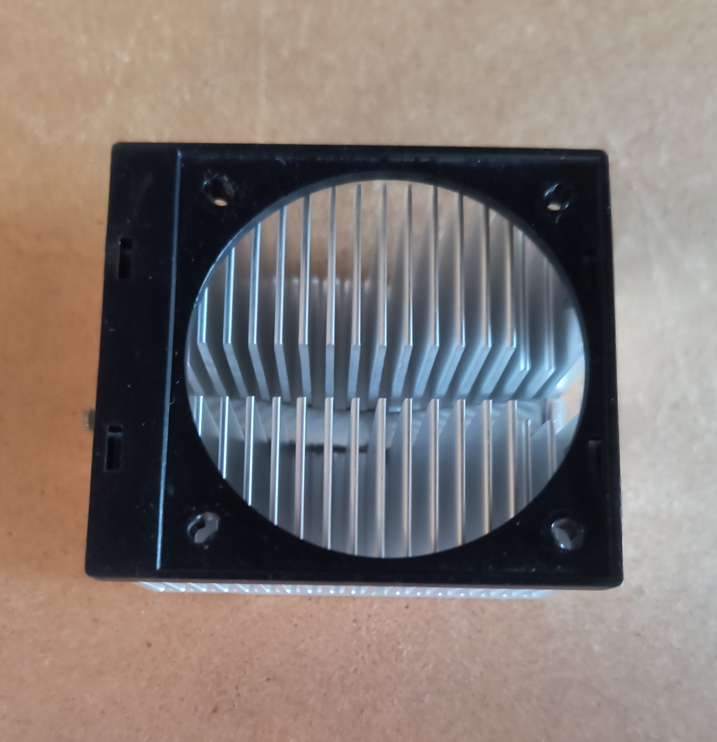 Aluminum CPU Heatsink with 60mm Fan Shroud Used - Image of the compact aluminum CPU heatsink with black plastic fan shroud, ideal for small desktop or DIY cooling applications